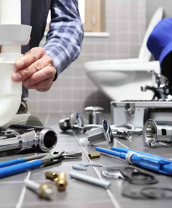 plumber at work in a bathroom, plumbing repair service, assemble and install concept. plumbing in omaha
