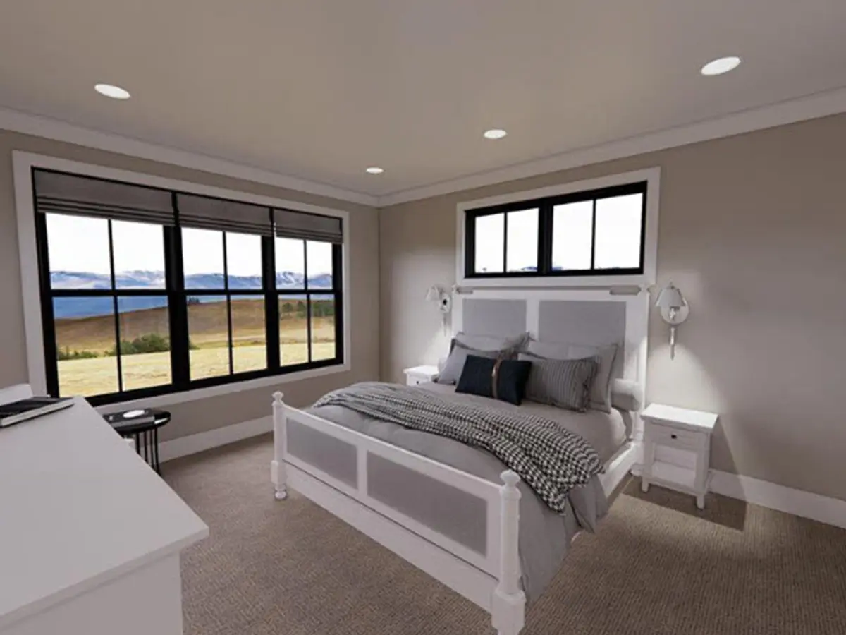 modern bedroom designed with a color scheme of white and gray tones. The highlight of the room is the large black windows that offer a stunning view of the majestic mountains.