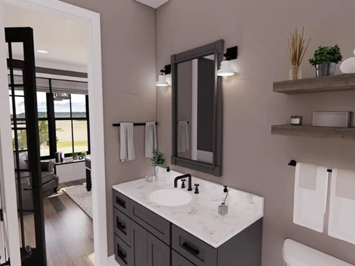 mall bathroom with gray cabinets, a white marble sink countertop, and a wall mirror