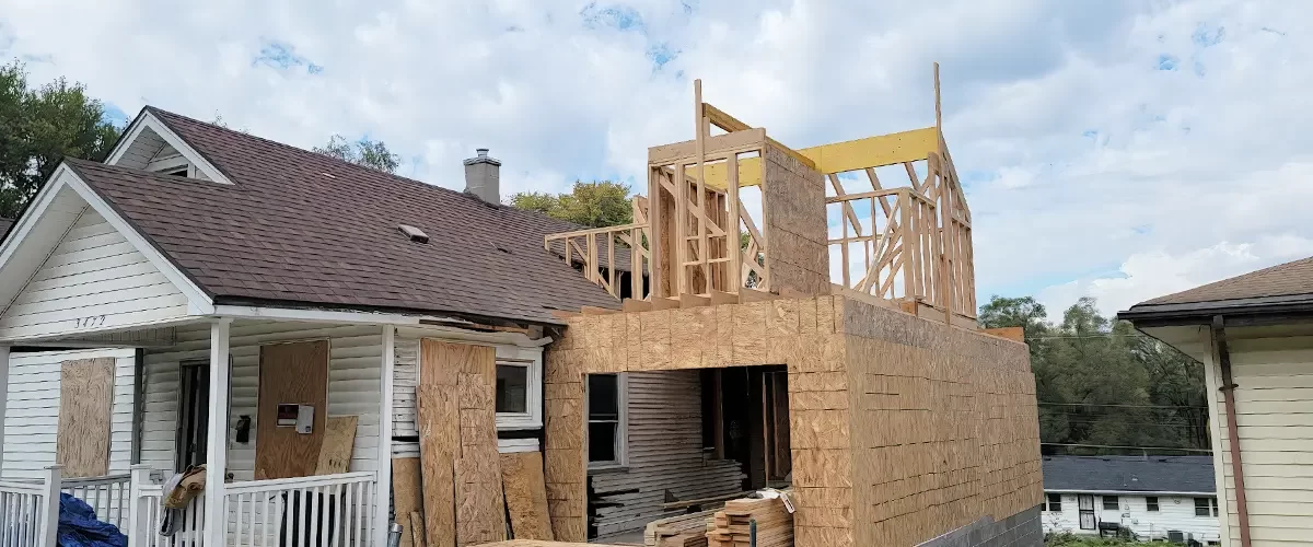 house additions under construction, wood frame build